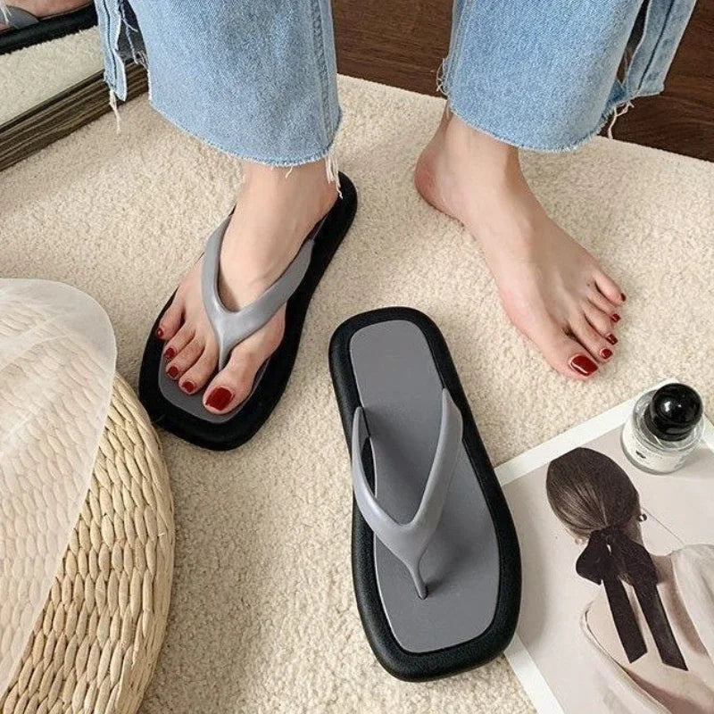 Women's summer flip flops by SHOWLU FASHION STORE, flat PVC slides with casual sandal design, suitable for warm weather wear.