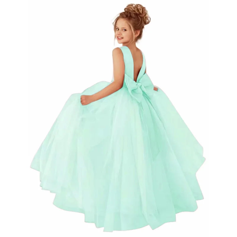 Dusty pink flower girl dress by Showlu Fashion Store with pearl belt, ball gown style for weddings, featuring floral details.