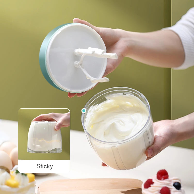 Showlu Smart General USB electric egg beater handheld mixer with mini whisk for cream and cake batter in a kitchen setting