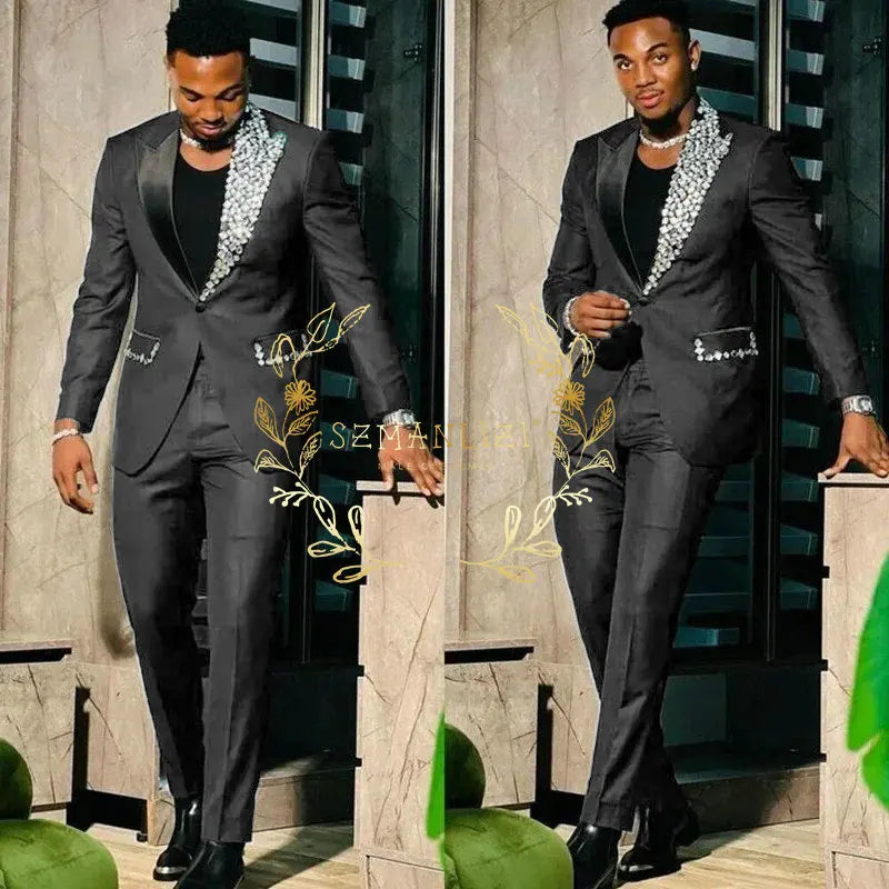 Men's black slim fit suit with single-breasted blazer and matching pants, featuring peak lapels, suitable for prom or party events.