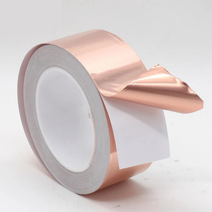 Copper tape with snail adhesive for EMI shielding and electrical repair, shown on stained glass or paper circuit.