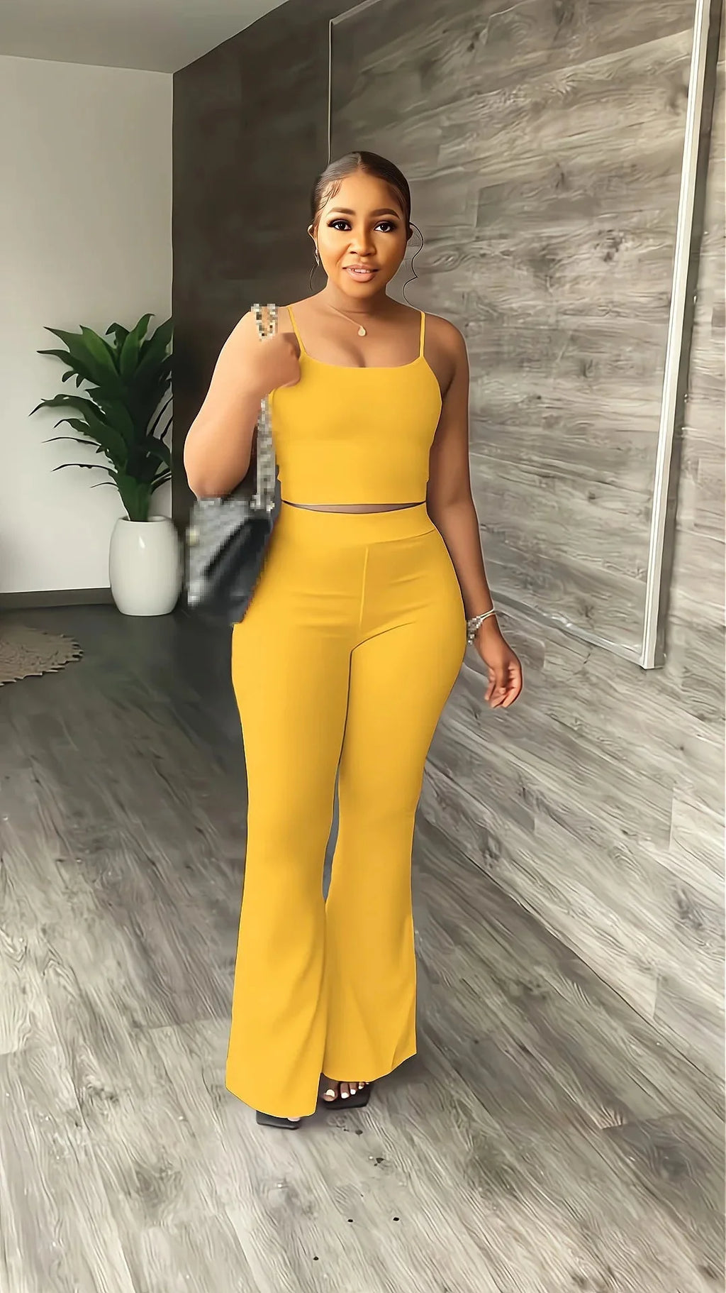 STEFION women's summer 2-piece set with sleeveless crop top and long pants, stylish and comfortable for warm weather.