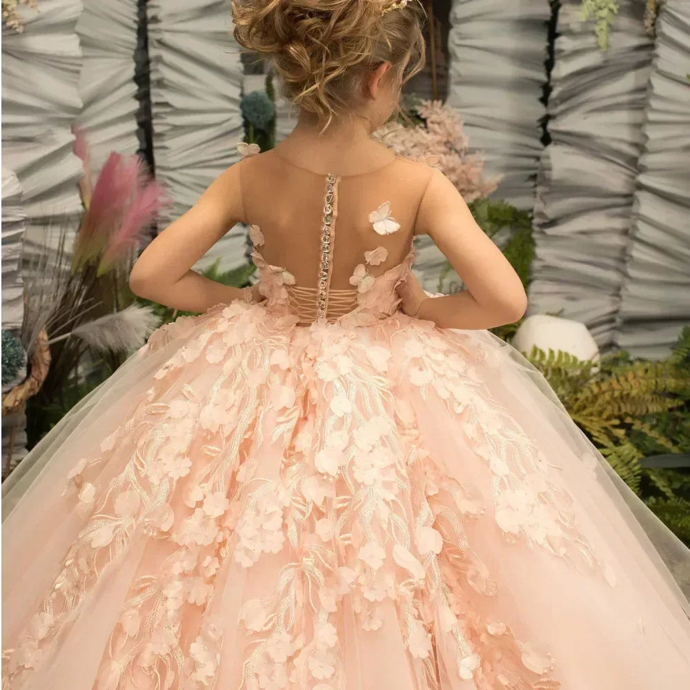 Pink flower girl dress by Showlu Fashion with 3D floral and butterfly appliqué, featuring a charming and elegant design
