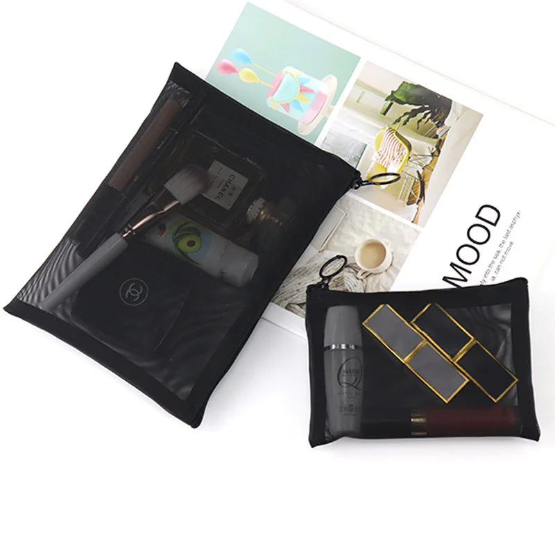 Large black outdoor travel makeup bag with transparent mesh compartments for organization and storage of cosmetics and toiletries.