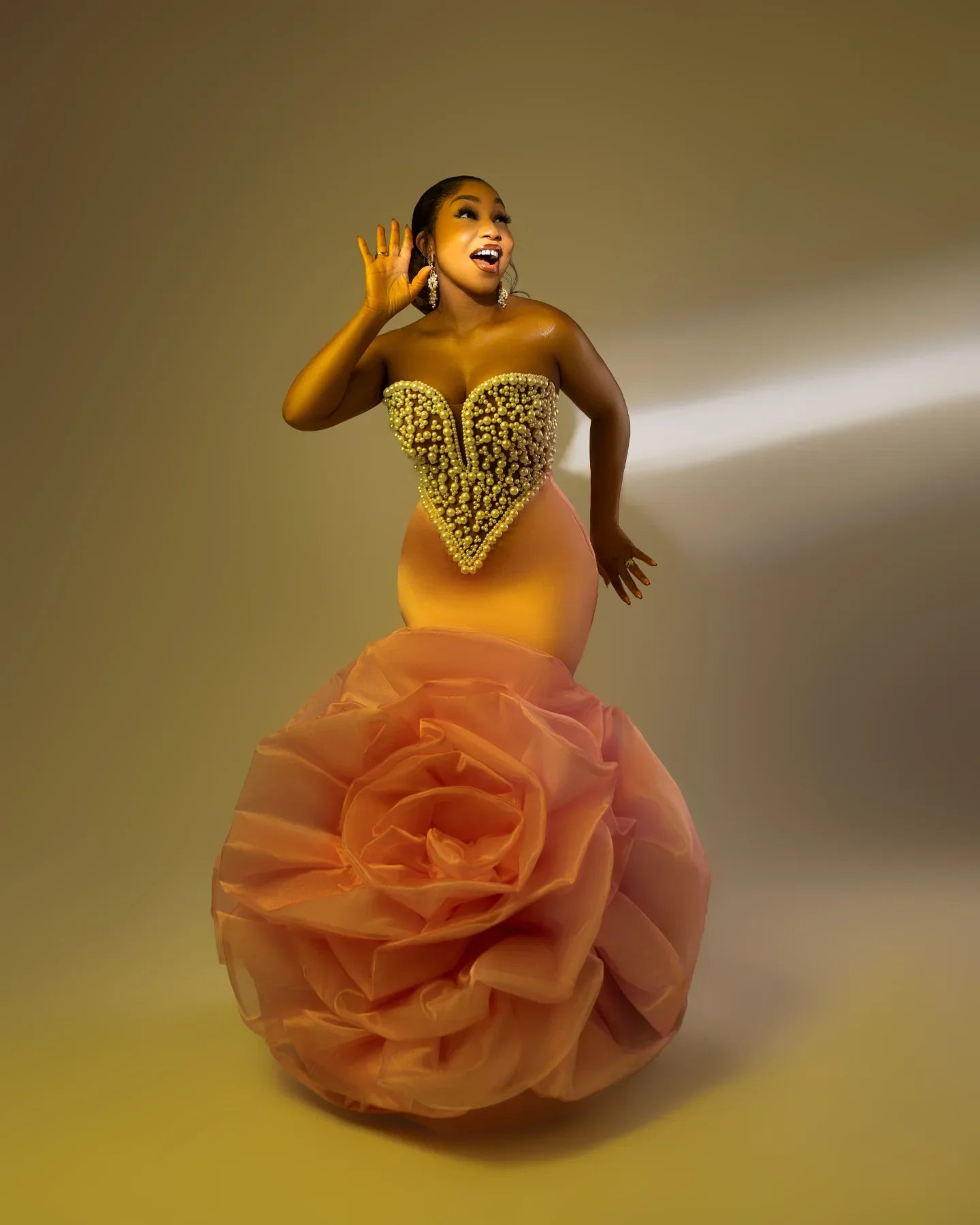 Elegant African wedding prom dress by Showlu Fashion with large floral design, luxury pearls, beads, and rose accents.