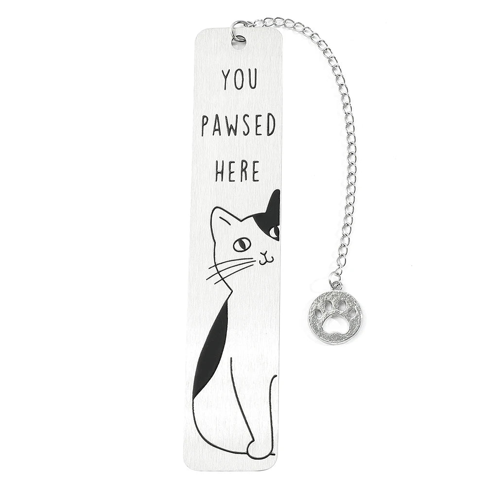 Colorful stainless steel waving cat bookmark with geometric design, ideal for marking pages in books.