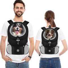 A man and a woman each wear a black mesh pet carrier backpack featuring a dog looking out.