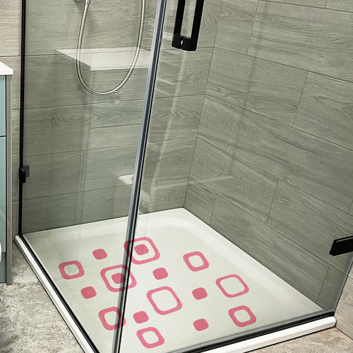 Showlu Smart General anti-slip bath stickers on a tiled bathroom floor, providing safety and traction in wet conditions.