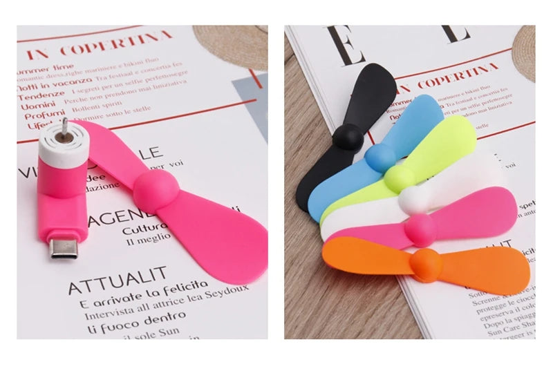 Showlu Smart General USB mini fan showing compact design with adjustable blades and a USB connector for portable cooling.