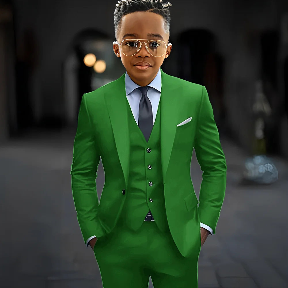 Dark grey boys' suit set with slim fit, single-breasted jacket, peak lapel, pants, and vest, perfect for formal occasions.