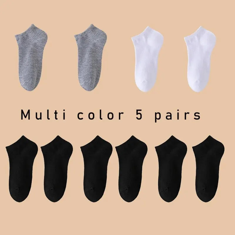 Five pairs of Showlu Fashion women's and men's low cut boat socks in solid colors, breathable, anti-slip, no-show ankle socks.