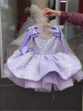 Pink flower girl dress by Showlu Smart General featuring sleeveless design, bow, sequins, and puffy skirt for wedding and party occasions.
