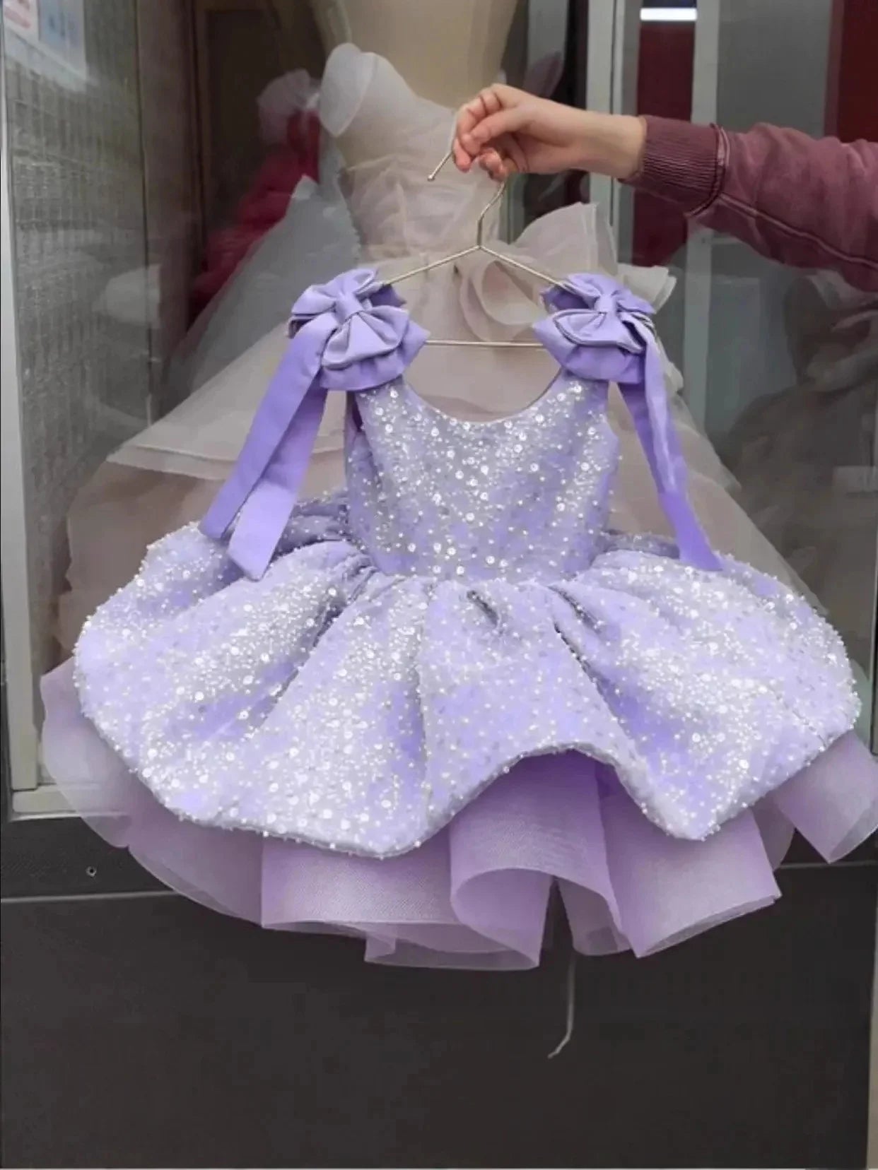 Pink flower girl dress for wedding and parties, sleeveless with bow, sequins, puffy style for kids' special occasions.