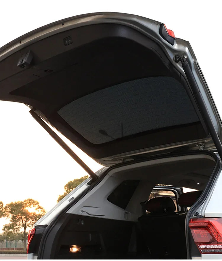 Magnetic car sunshade from Showlu Fashion Store, featuring a reflective surface and easy attachment to vehicle windows.