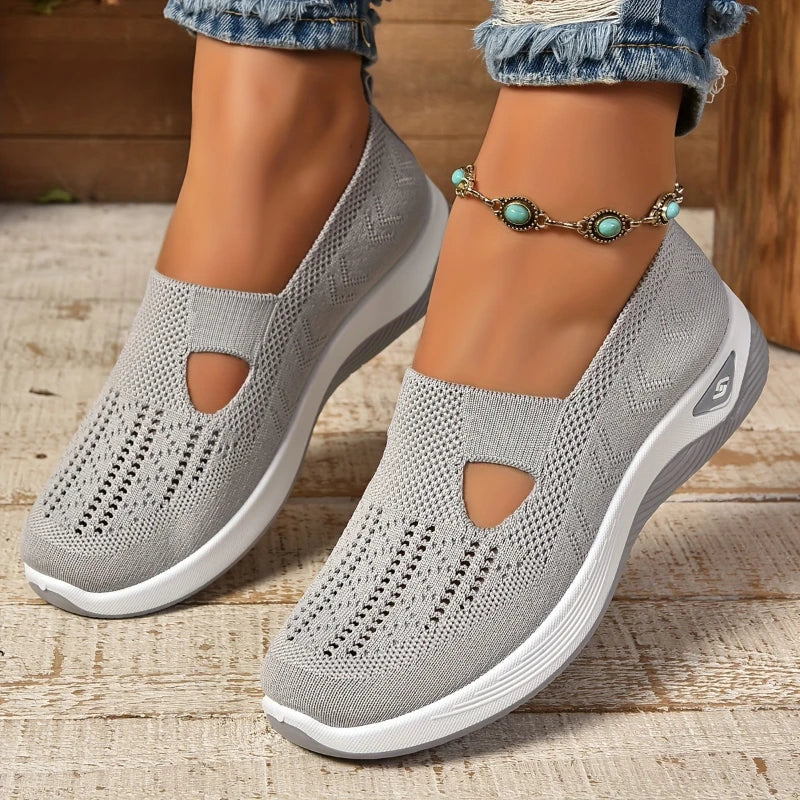 Breathable women's slip-on sneakers with mesh upper, soft sole, lightweight vulcanized shoes, ideal for summer walking.