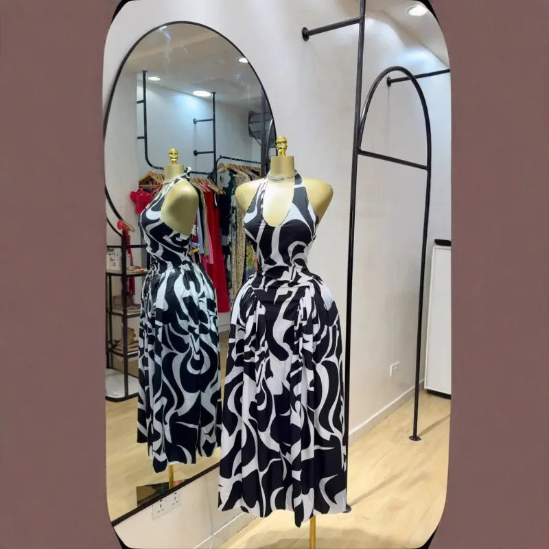 Elegant 2025 women’s V-neck sleeveless halter midi dress with backless design, floral print, perfect for birthday and beach parties.