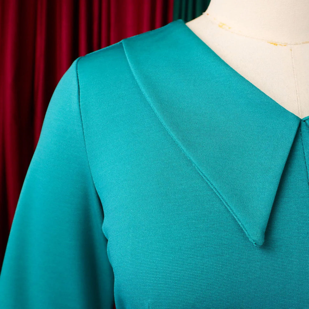 Elegant office dress for women, V-neck, half sleeves, belt waist, pleated mid-calf length, suitable for professional work settings.