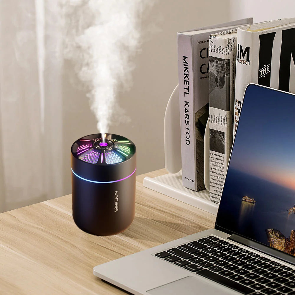 Showlu Smart General Mini USB Humidifier emitting a fine mist, compact design ideal for desktop or small space use.