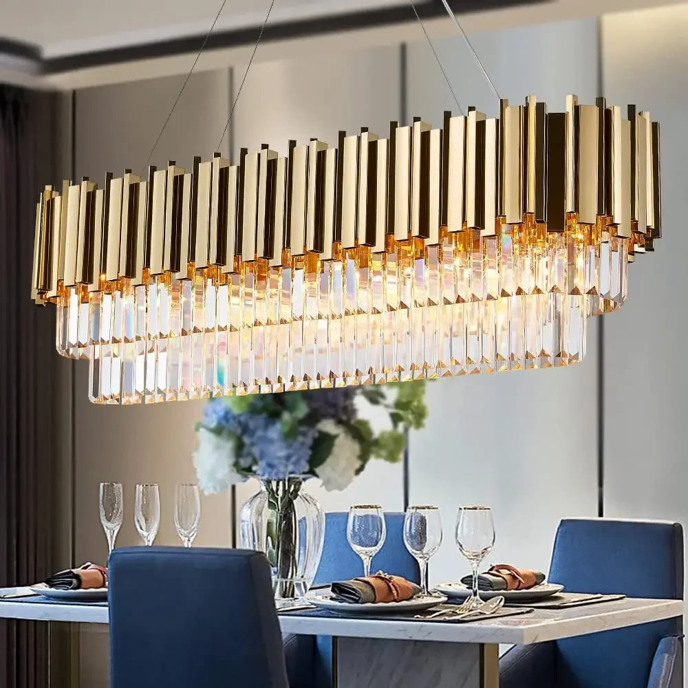 Elegant gold crystal chandelier lighting with oval pendant design, ideal for dining rooms and kitchen island lighting.