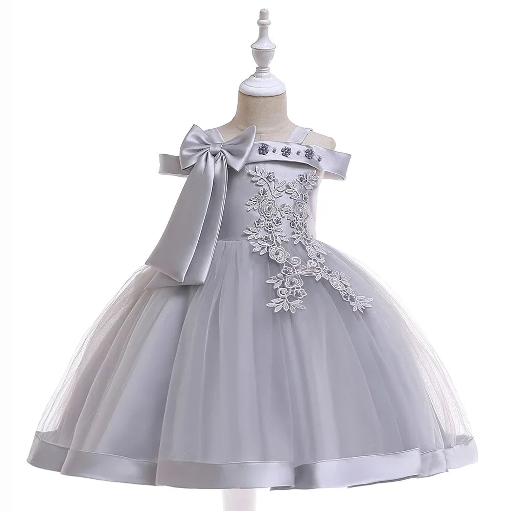 Elegant pink kids Christmas party dress for girls with appliqué flowers, bow, and tulle skirt, perfect for birthdays or weddings.