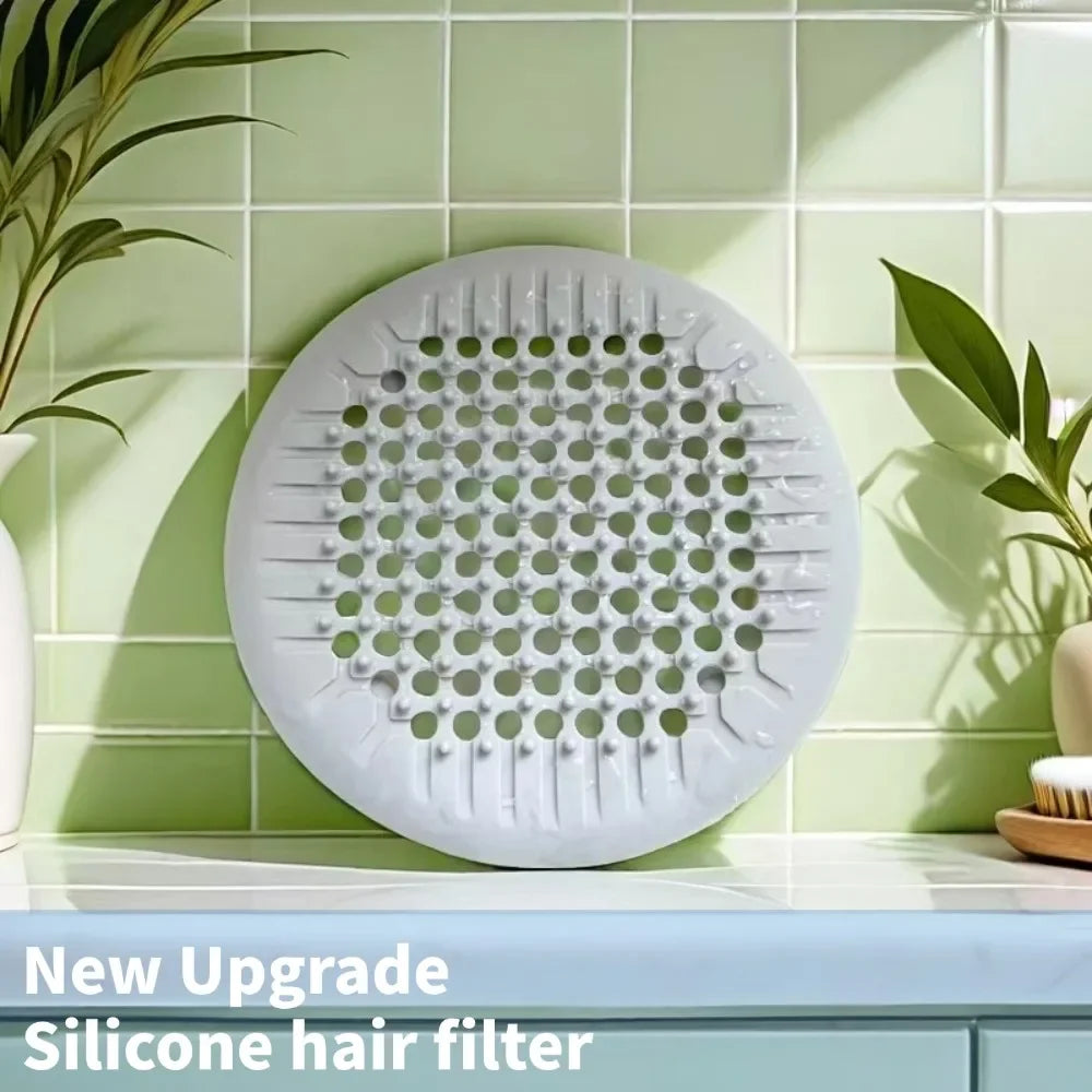Showlu Smart General silicone drain cover with flexible, mesh design for blocking debris in kitchen or bathroom drains.