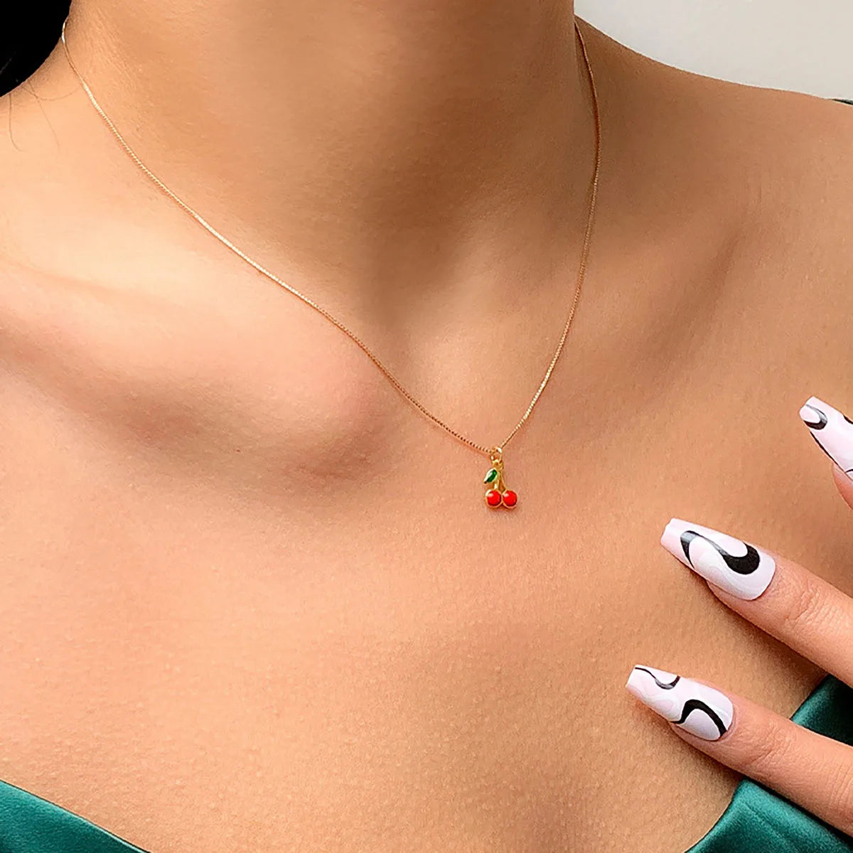 Gold-colored boho clavicle necklace with cherry pendant, romantic jewelry for women, stylish gift idea from Showlu Fashion.
