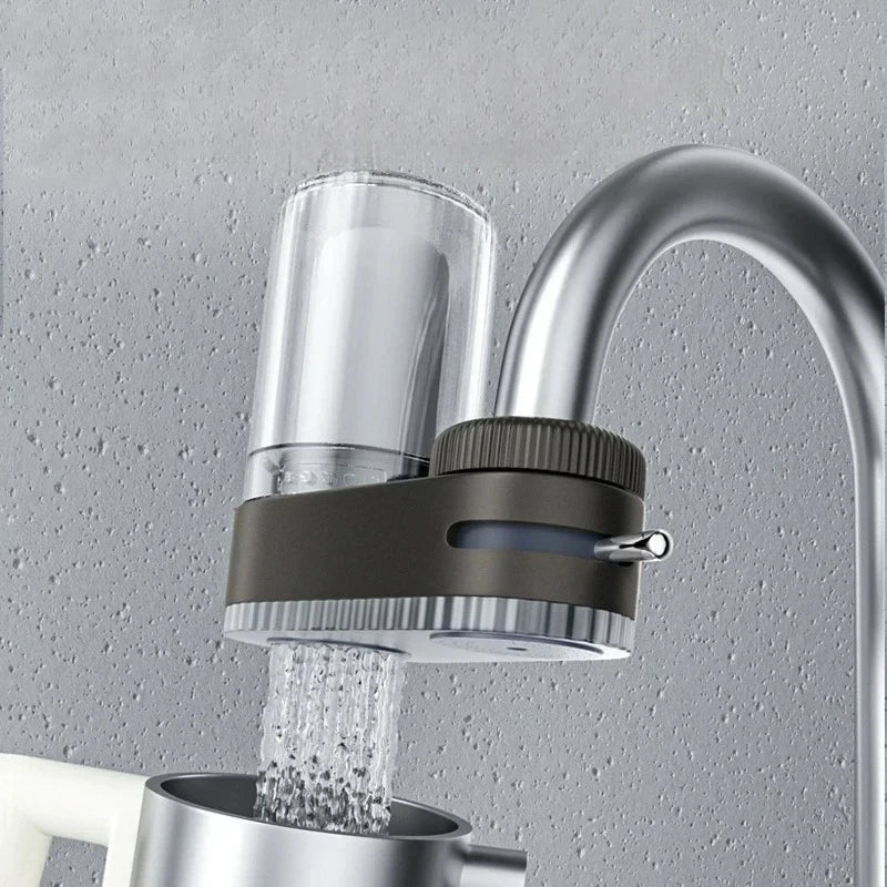 Showlu universal faucet water purifier with washable ceramic filter element, installed on a kitchen sink faucet.