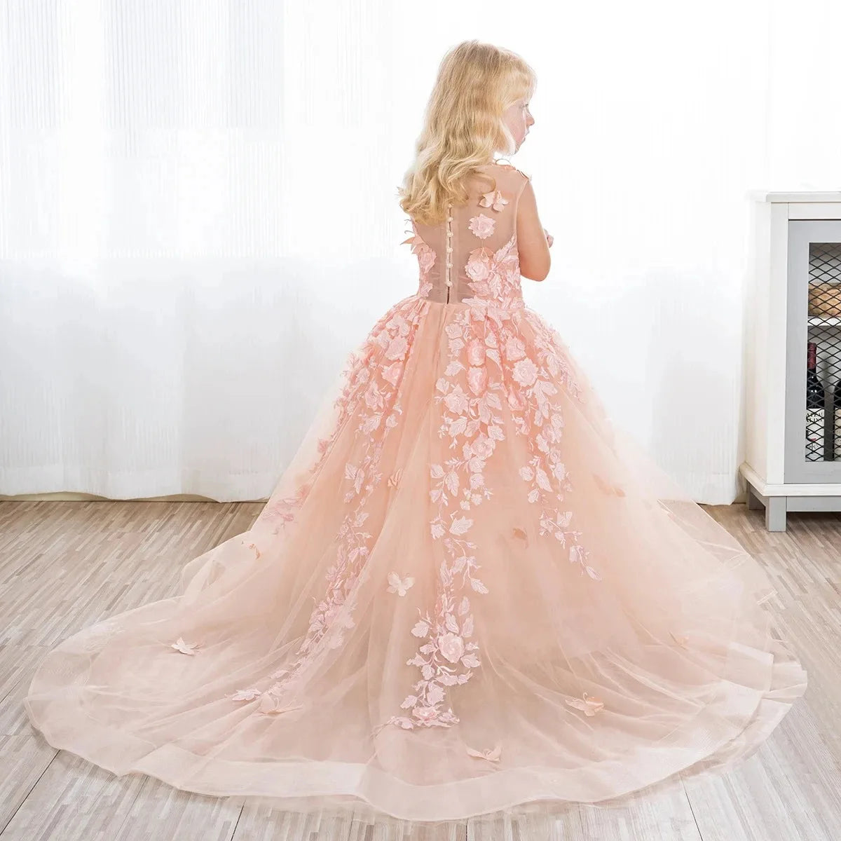 Pink flower girl dress by Gdybao with lace appliqué and tulle, perfect for first communion or special occasions.