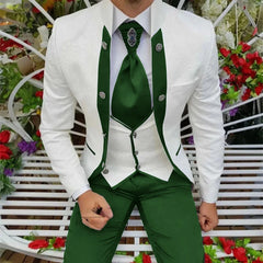 A man wears a three-piece suit featuring a white patterned jacket, a white vest, and green trousers with a matching green tie.
