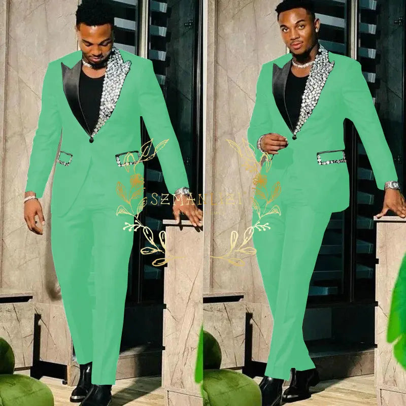 Black men's slim fit suit with single-breasted blazer and matching pants, featuring peak lapel and high-quality crystal embellishments.