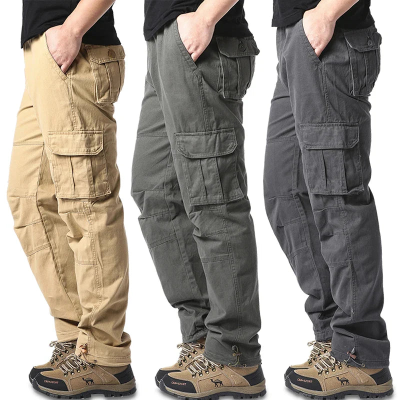 Men's cotton cargo pants in loose fit tactical jogging style, shown in dark color with multiple utility pockets