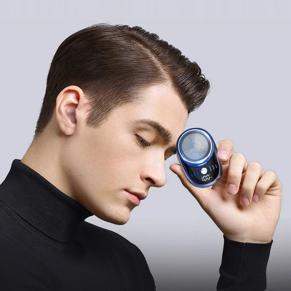 Men's mini electric travel shaver by Showlu Fashion, USB rechargeable beard trimmer with digital display and washable design.