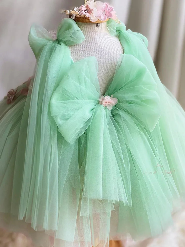 Pink girl dress with embroidery flower and large bow, featuring puff skirt and back design, suitable for Halloween, wedding, or special occasions.