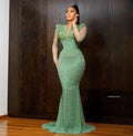 Green African Aso Ebi evening gown with mermaid silhouette, long sleeves, crystals, and tailored fit for formal parties and prom events.