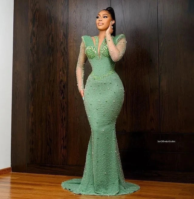 Green African Aso Ebi evening gown with mermaid silhouette, long sleeves, crystals, and tailored fit for formal parties and prom events.