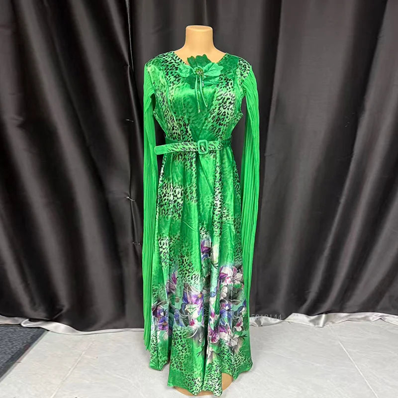 Elegant African dress for women featuring Ankara fabric, sequins, and a long dashiki style for wedding or party occasions.