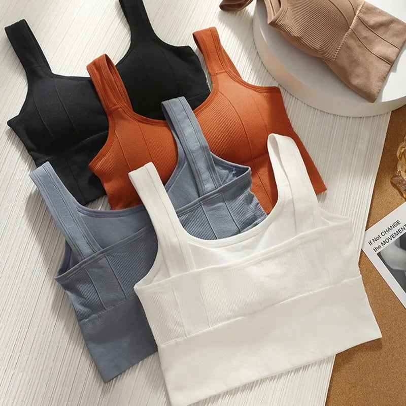 Seamless women's breathable sports bra with anti-sweat fabric, shockproof design, and push-up support for gym and yoga workouts.