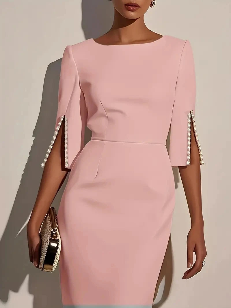 Showlu Women's beaded slim fit midi dress with round neck and sheath silhouette, elegant design, displayed on a hanger.