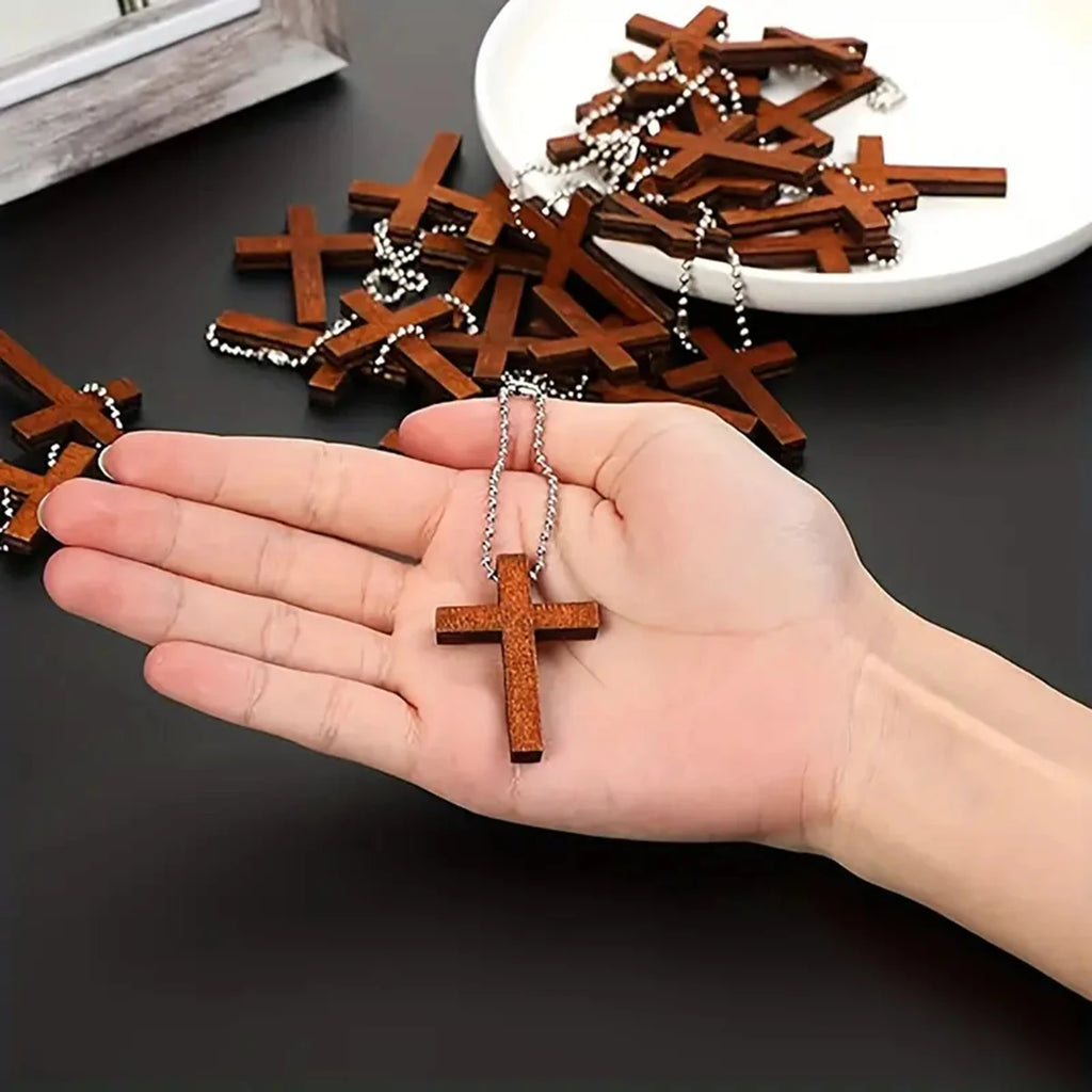 Set of 10/20/30/40 handmade wooden Christian cross ornaments for home decoration and craft projects, featuring natural wood patterns.