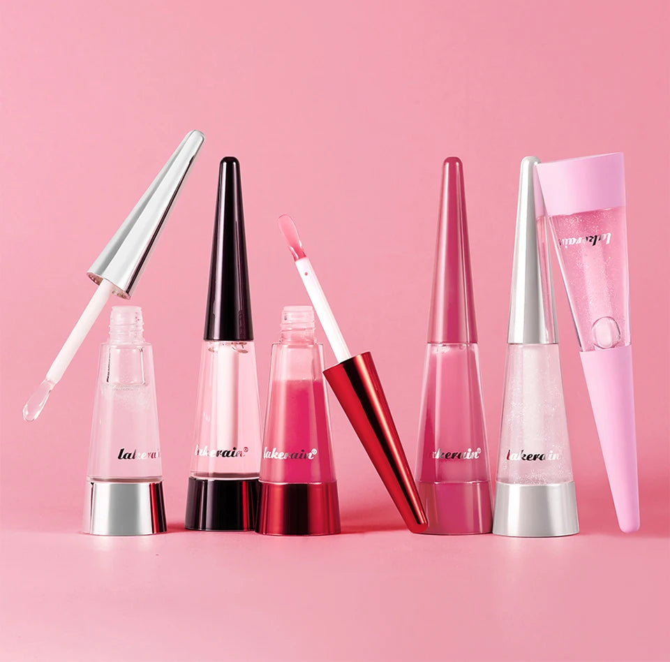 Showlu Smart General Lip Oil Plumper bottle with applicator, showcasing the sleek packaging and clear liquid formula.