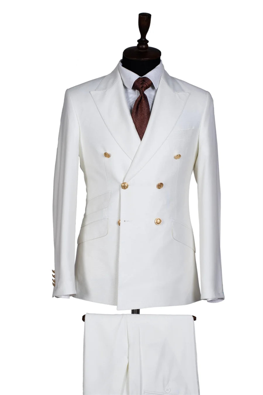 Slim fit men's tuxedo suit with double-breasted jacket and matching pants, featuring peak lapels, suitable for weddings and formal events.