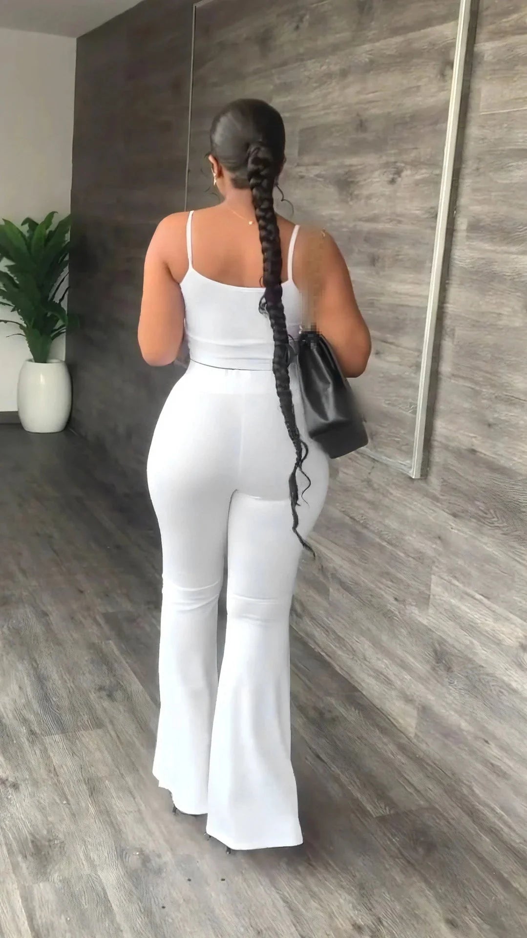 Stefion women's 2-piece summer set with sleeveless crop top and long pants, shown in a stylish, casual outfit.