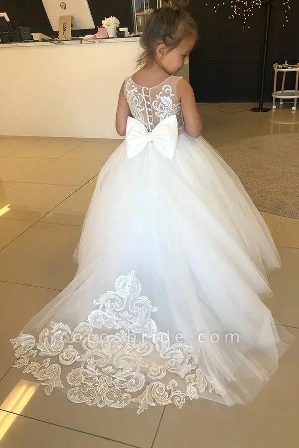 White ivory lace long sleeve flower girl dress with bow, tulle skirt, suitable for weddings, first communion, and special occasions.