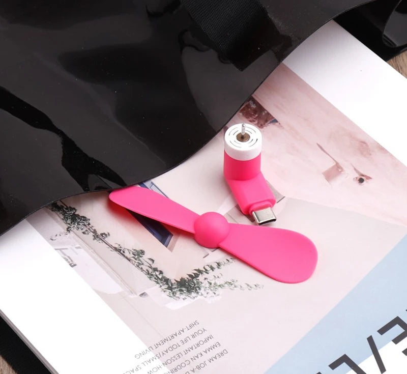 Showlu Smart General USB Mini Fan with adjustable blades and compact design, perfect for portable cooling on the go.
