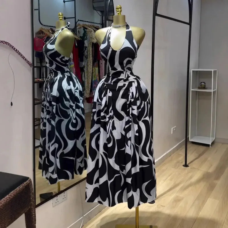 Women’s sleeveless V-neck halter midi dress with backless design, floral print, suitable for beach parties and birthdays.