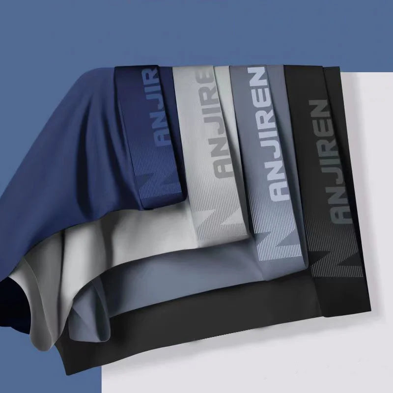 Four pairs of Showlu Fashion men's ice silk boxer shorts, breathable and thin U-convex underwear in various sizes, close-up view.