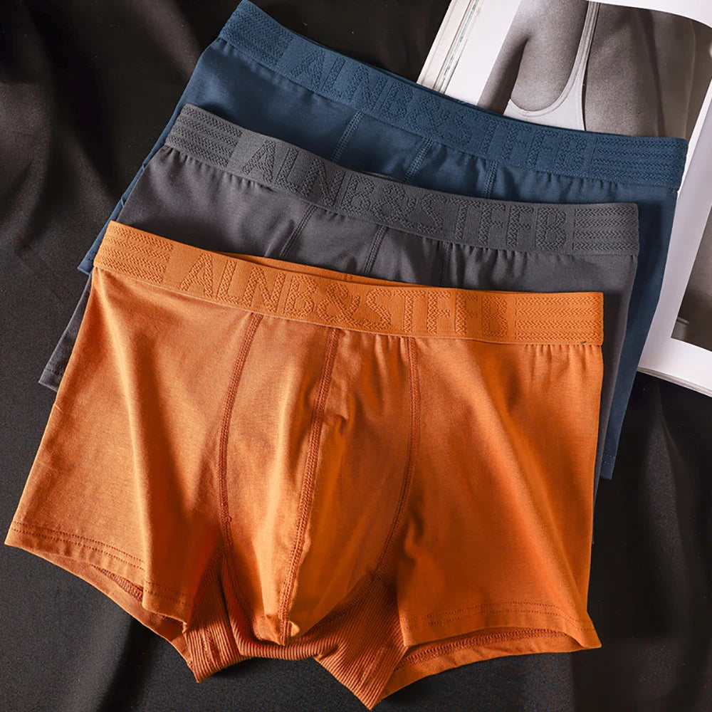 Three pairs of Showlu Fashion Store men's cotton antibacterial boxer briefs with double-layer breathable U pouch in a pack.