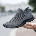 SHOWLU Men's breathable mesh walking shoes with slip-on design and running sneaker style, ideal for casual athletic wear.
