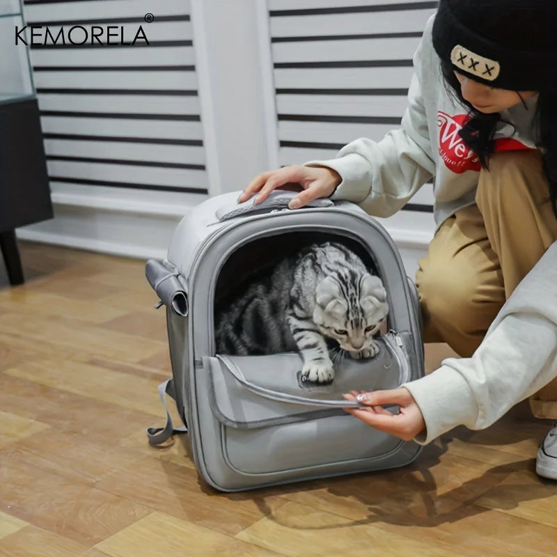 Large mesh pet carrier backpack for cats and medium dogs by KEMORELA, showing breathable mesh sides and comfortable straps.