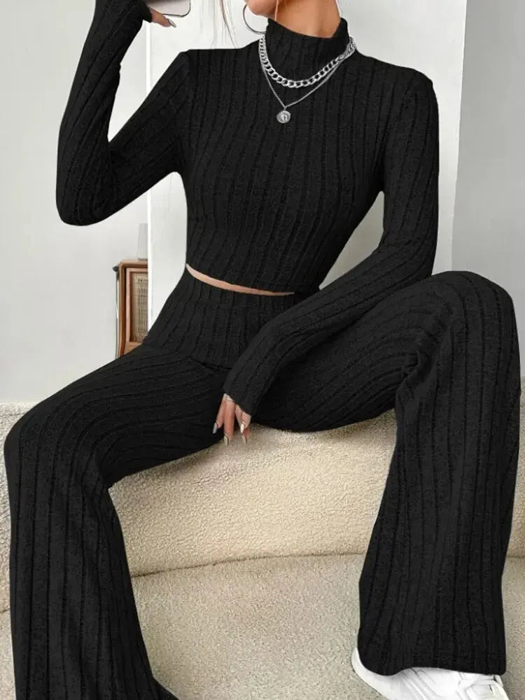 Stand collar Navel T-shirt and trumpet pants by Showlu Fashion Store, featuring stylish, fitted designs in a casual outfit.